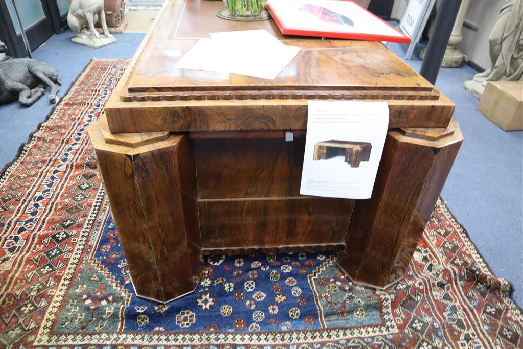 A French Art Deco rosewood desk in the manner of Paul Follot